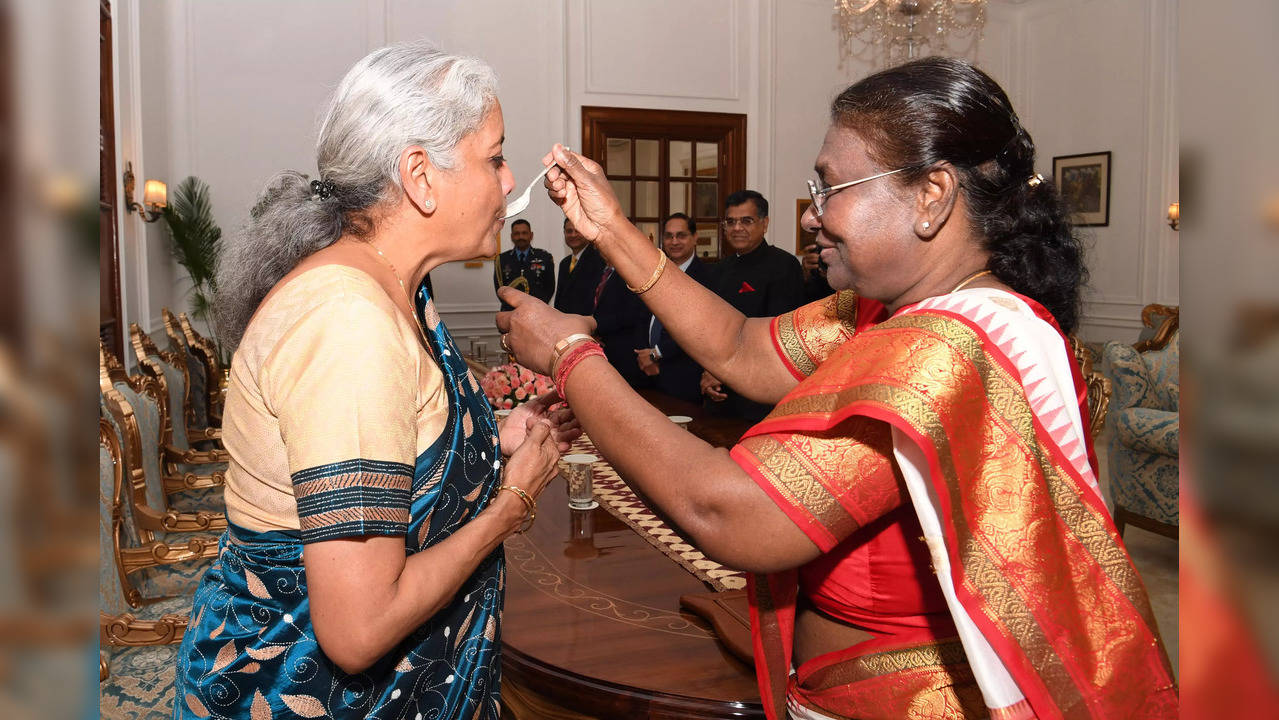 President Droupadi Mumru feeds Dahi Cheeni to Finance Minister Nirmala Sitharaman. | Courtesy: @rashtrapatibhvn/X