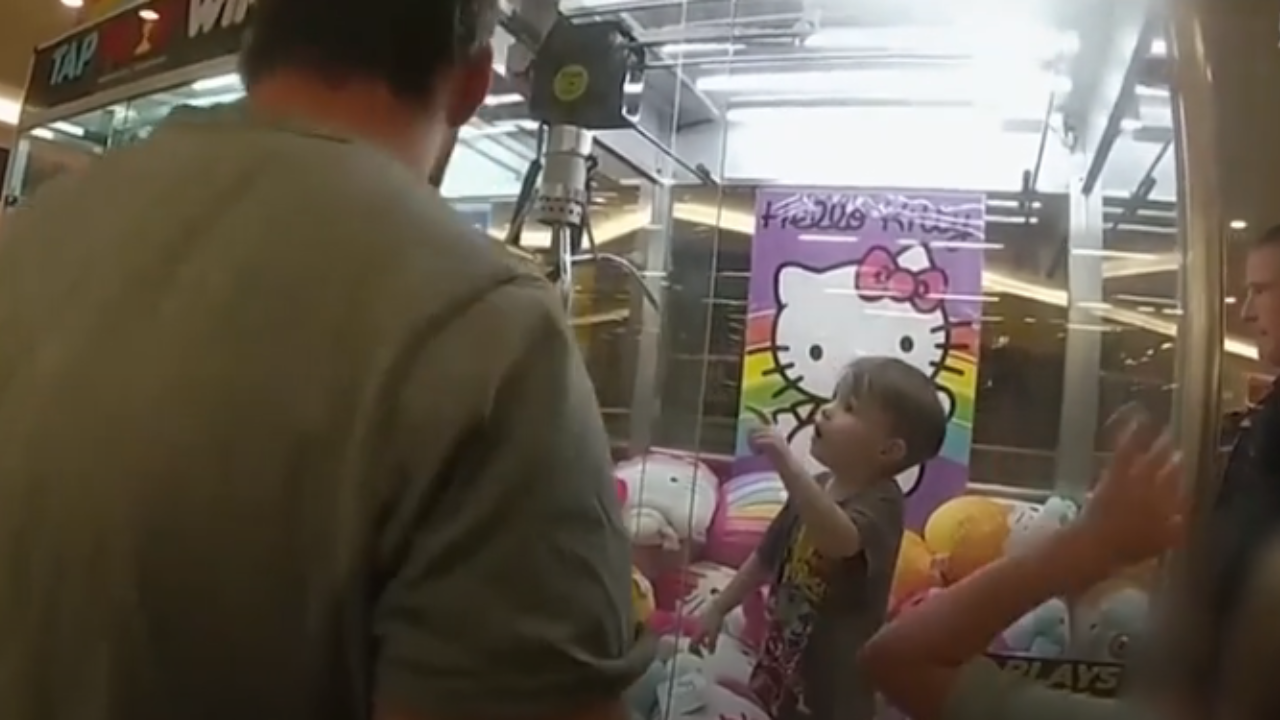 Toddler stuck inside toy machine