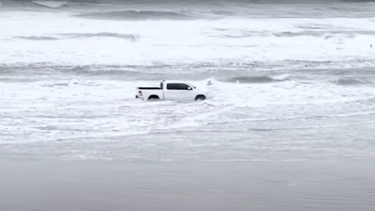 Jason Brzuszkiewicz drives his pickup truck in New Smyrna Beach waters. | Courtesy: Volusia Sheriff