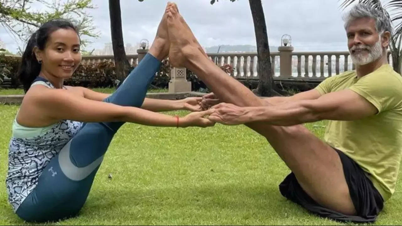 practice this couple yoga poses for weight loss with partner.