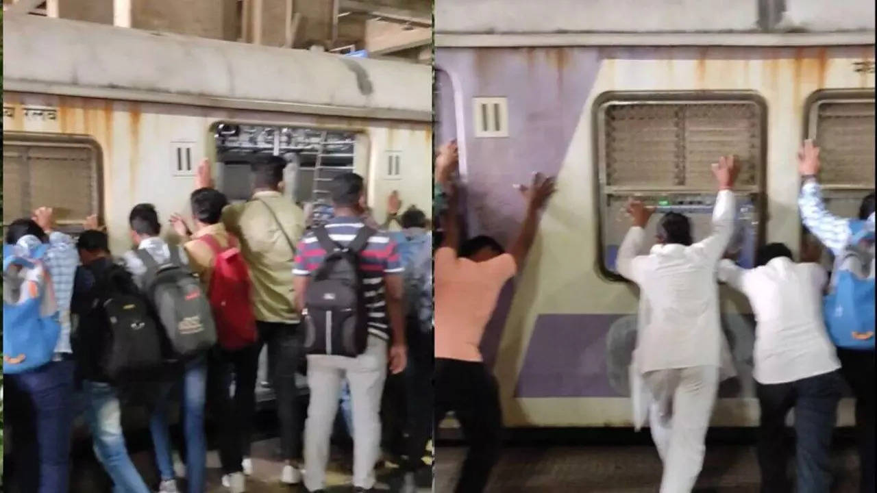 push whole train coach mumbai local train passenger to rescue man