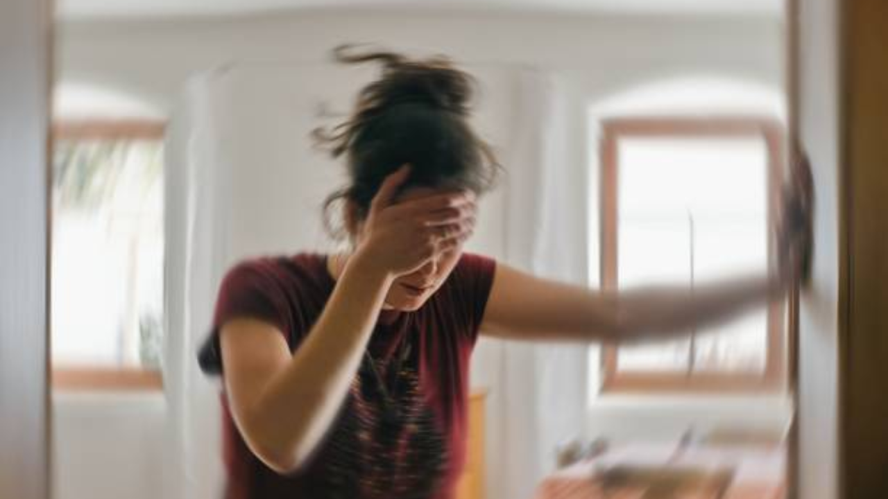 Woman punches teacher on face.