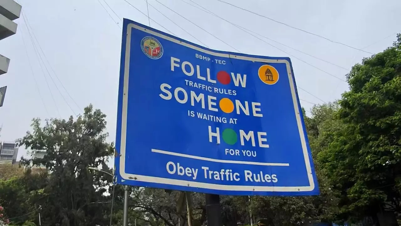 A BBMP traffic sign reads 'Follow someone home' from afar in Bengaluru. | Courtesy: Sumukh Rao/X