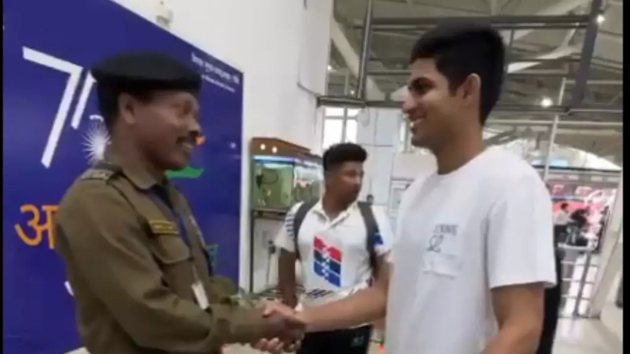 Shubman Gill with Robin Minz's father at Birsa Munda International Airport in Ranchi.