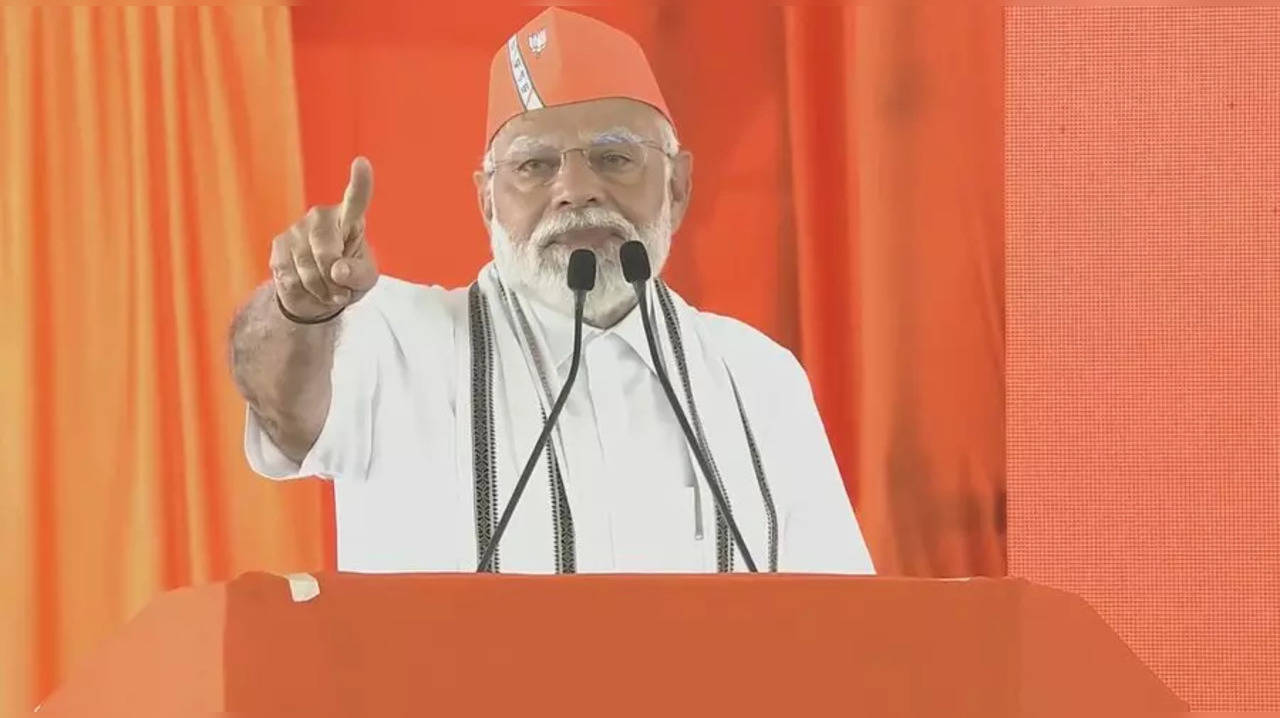 PM Modi addressing a public meeting in Adilabad, Telangana.