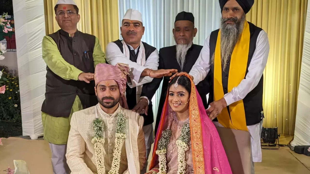 A Pandit, a Maulvi and a Granthi bless the newlywed couple.| Courtesy: @TheSatishDua/X