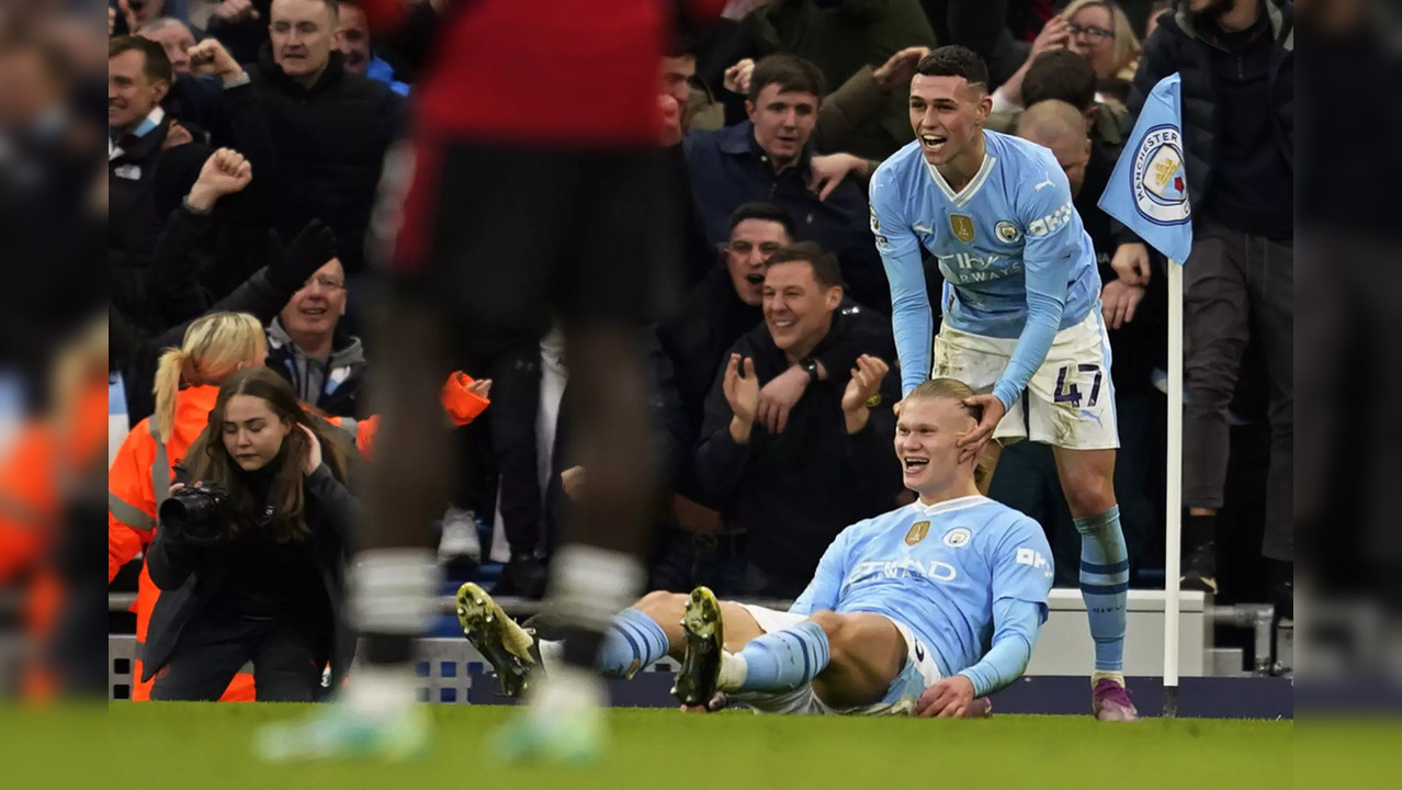 Erling Haaland celebrates with Phil Foden