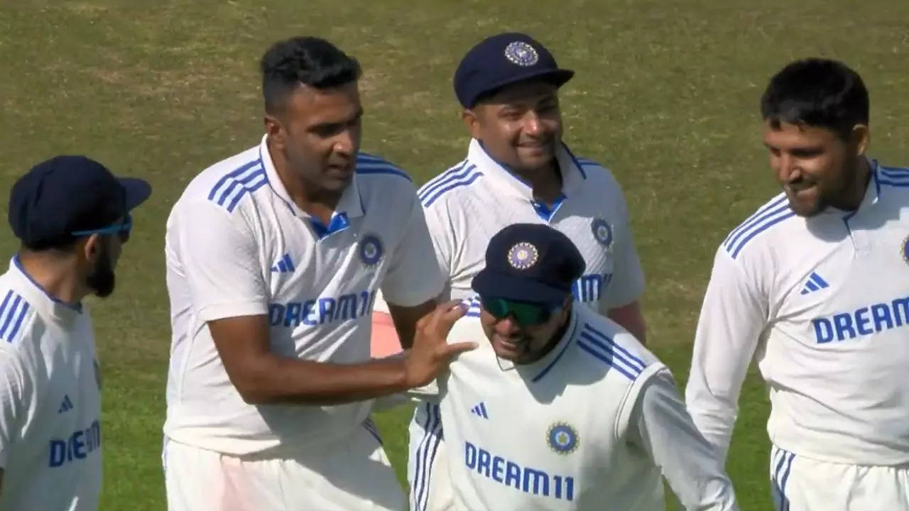 Ravichandran Ashwin and Kuldeep Yadav share a moment during the fifth Test between India and England on Thursday in Dharamsala.