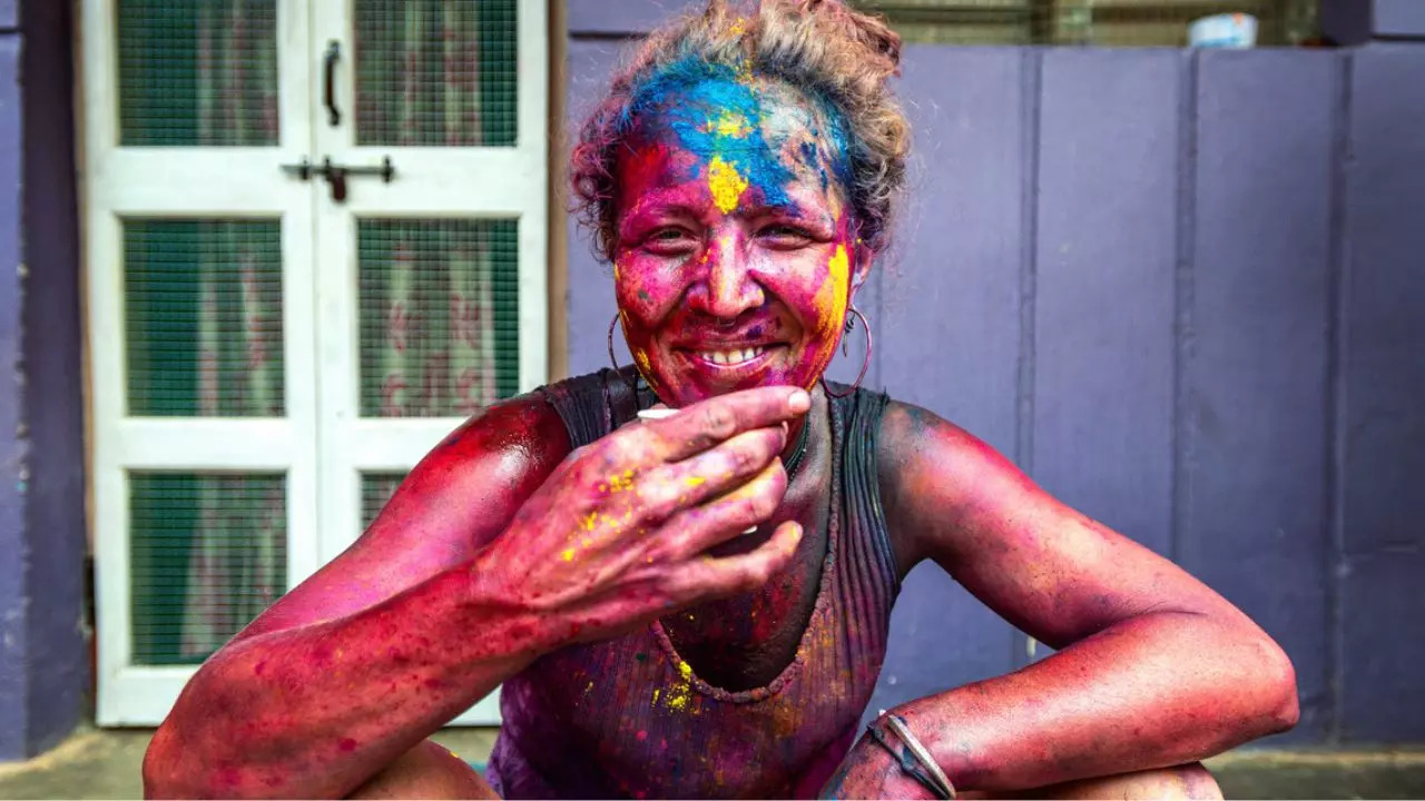 A foreigner drenched in colours in Hampi. Credit: iStock