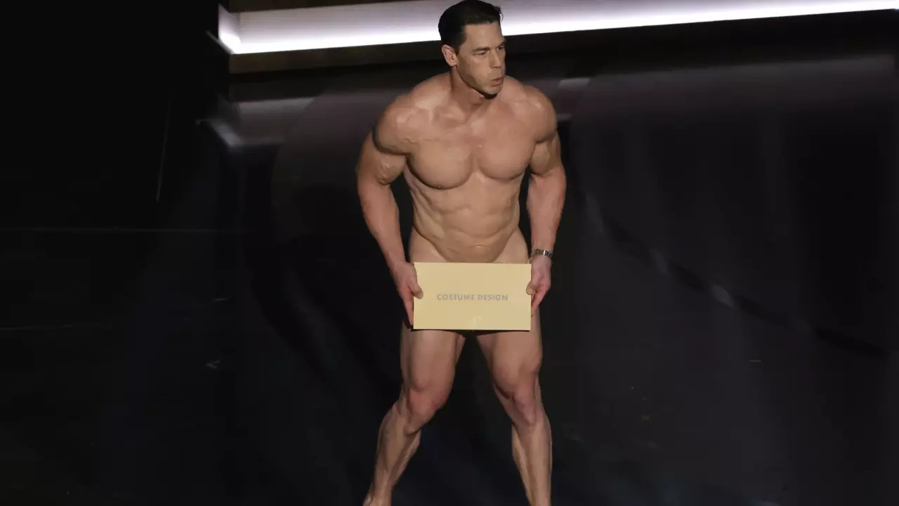 A naked John Cena presents the Best Costume Design award at Oscars 2024. | Courtesy: Getty Images