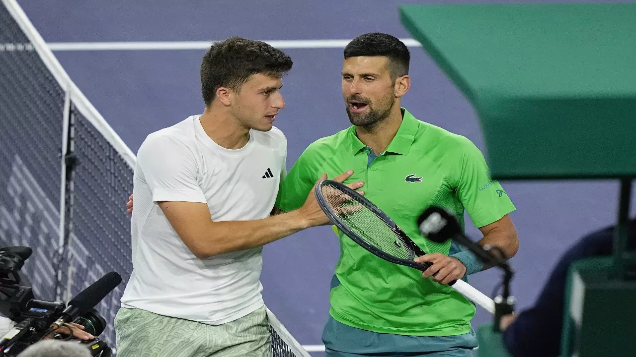 Luca Nardi with Novak Djokovic