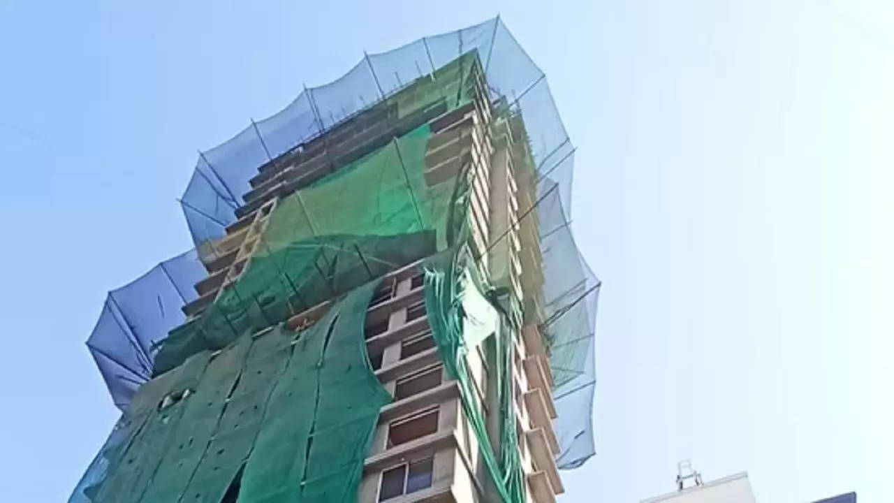 scaffolding from under construction building collapses