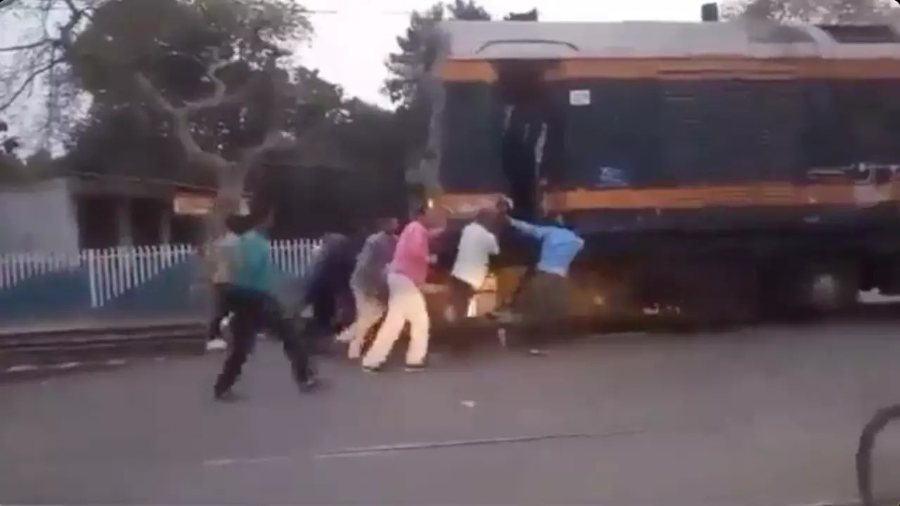 Railways staff push an inspection car manually in Amethi.| Courtesy: UP Congress/X