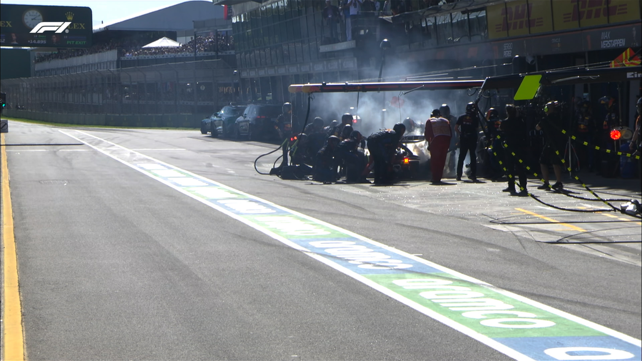 Red Bull trying to put out fire on Max Verstappen's car in the pits