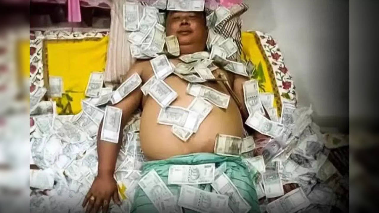 A purported photo of Benjamin Basumatary​ went viral on social media where he can be seen sleeping on a 'bed of cash'.