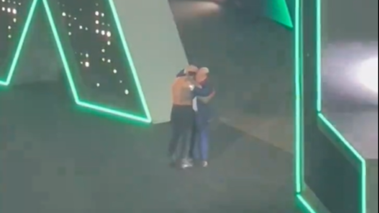 Paul Heyman Hugging Roman Reigns 