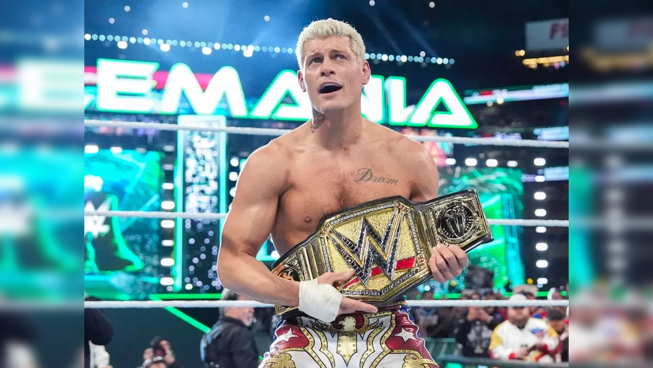 Cody Rhodes with the WWE Universal Championship belt