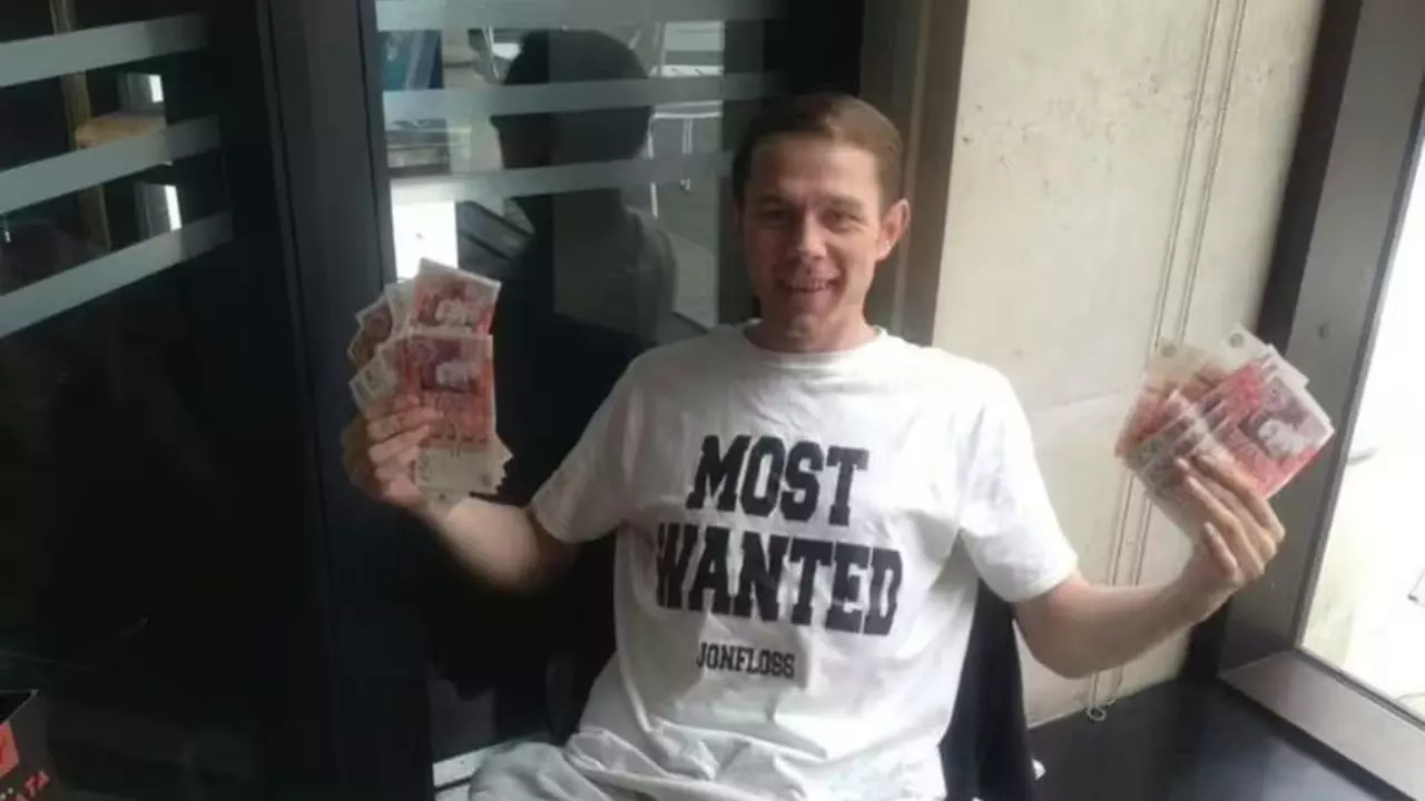 'Mark Goodram, one of the debit card thieves, poses with his lottery cash prize' - SWNS