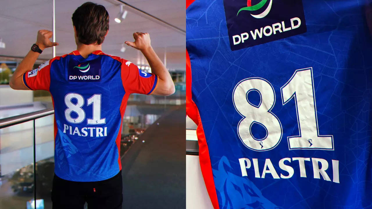 F1 driver Oscar Piastri poses in Delhi Capitals shirt