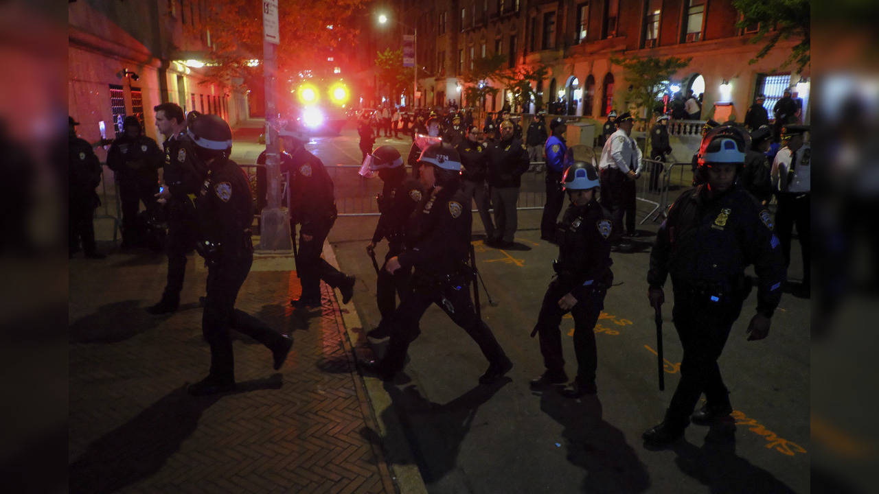 Hundreds of police officers swept into Columbia University on Tuesday night