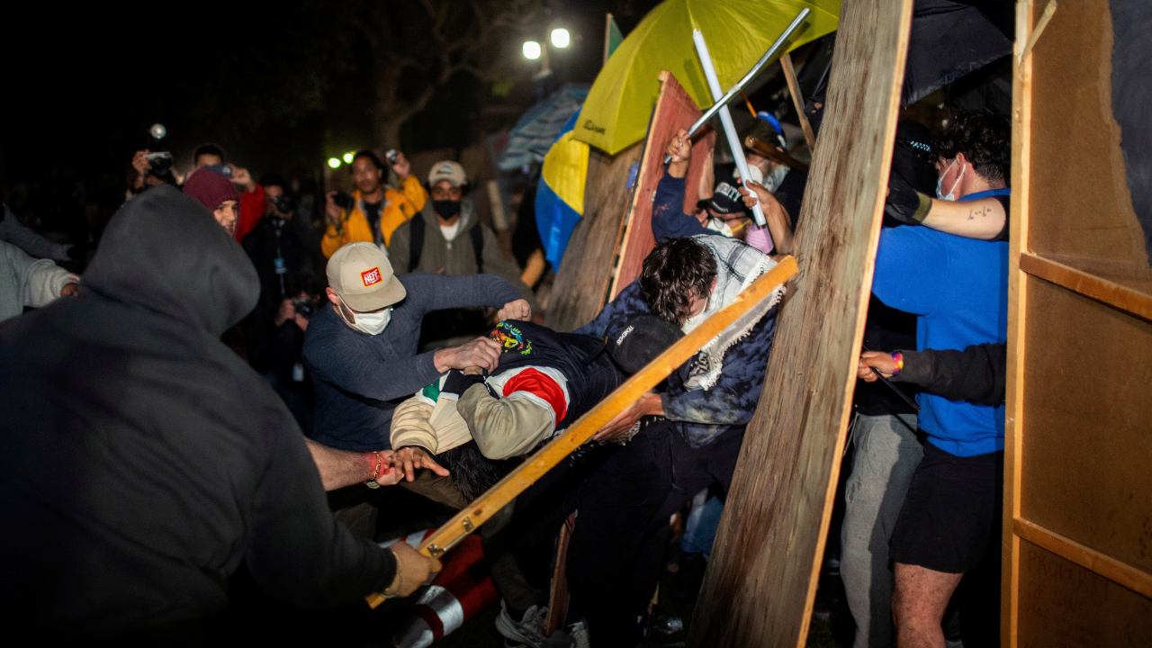 Demonstrators clash at an encampment at UCLA