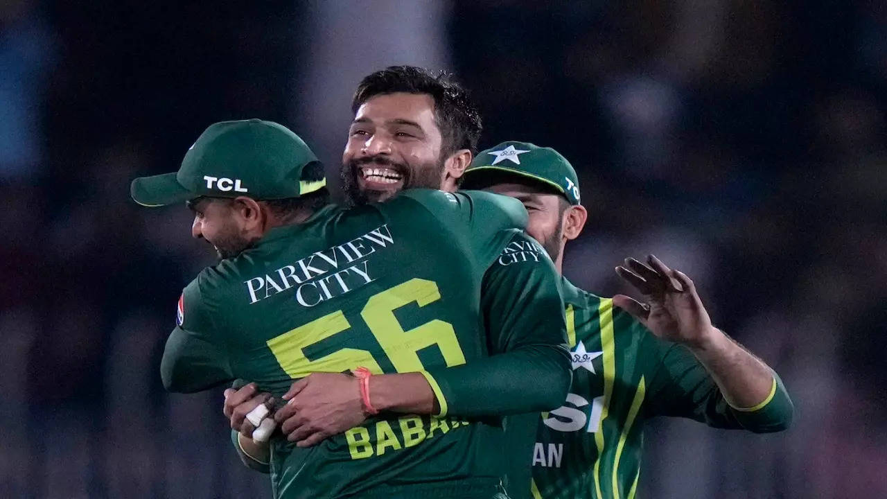 Mohammad Amir celebrates his wicket with Babar Azam