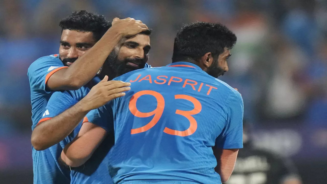 Jasprit Bumrah, Mohammed Shami and Mohammed Siraj celebrate a wicket