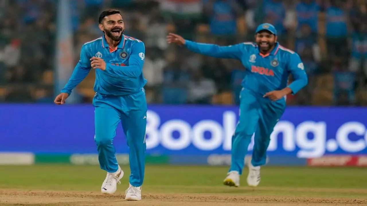 Virat Kohli and Rohit Sharma celebrate a wicket