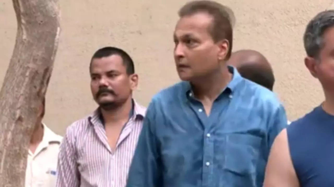 Mumbai Elections: Industrialist Anil Ambani stands in a queue at a polling booth.