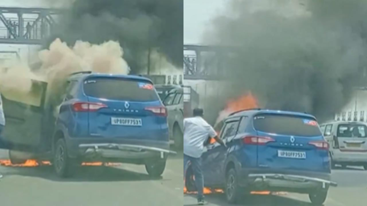 Moving car catches fire on Delhi-Meerut Expressway. (Credits: Twitter/@JayDixit_)