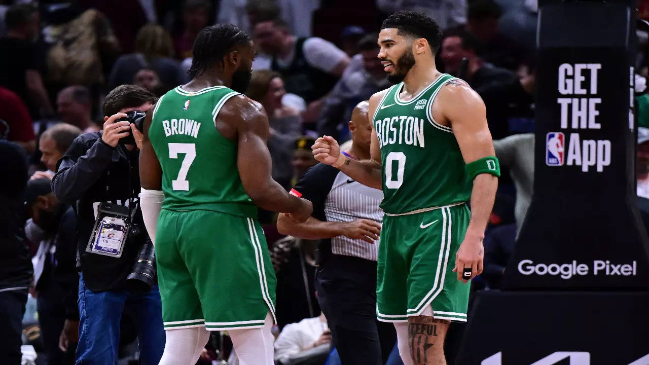 Boston Celtics' Jayson Tatum and Jaylen Brown congratulating each other