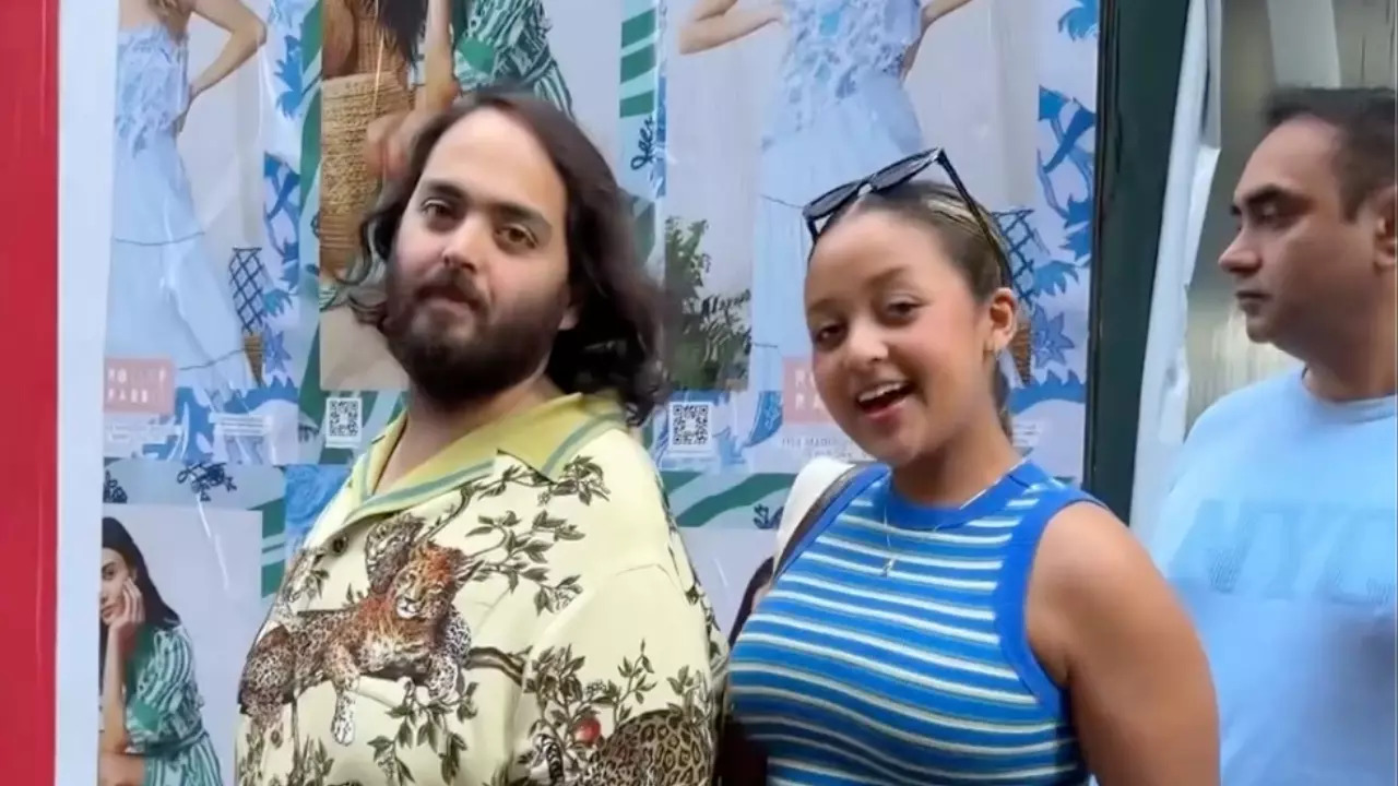 A New York City native, joins pedestrians posing  with Anant Ambani for a picture. | Bethany Zesu