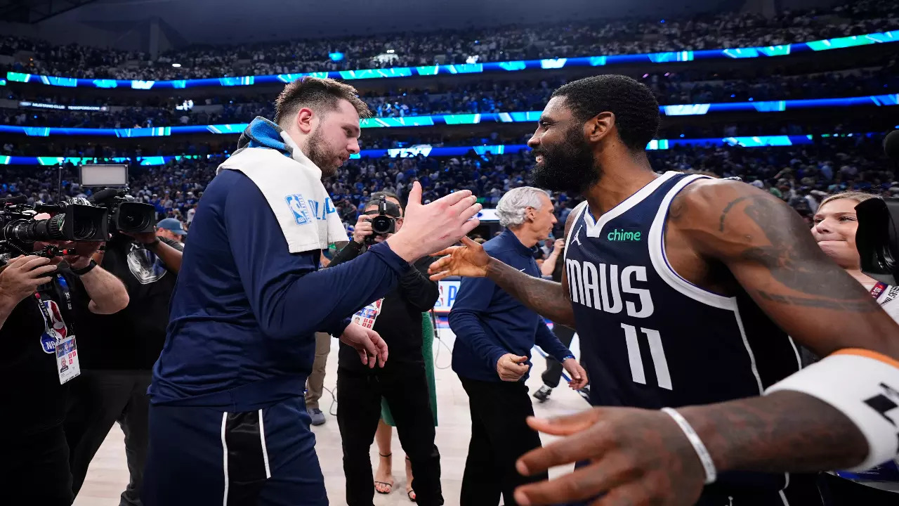 Dallas Mavericks' Luka Doncic celebrate with Kyrie Irving