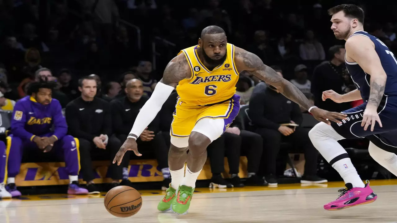 LeBron James with Luka Doncic during a NBA game