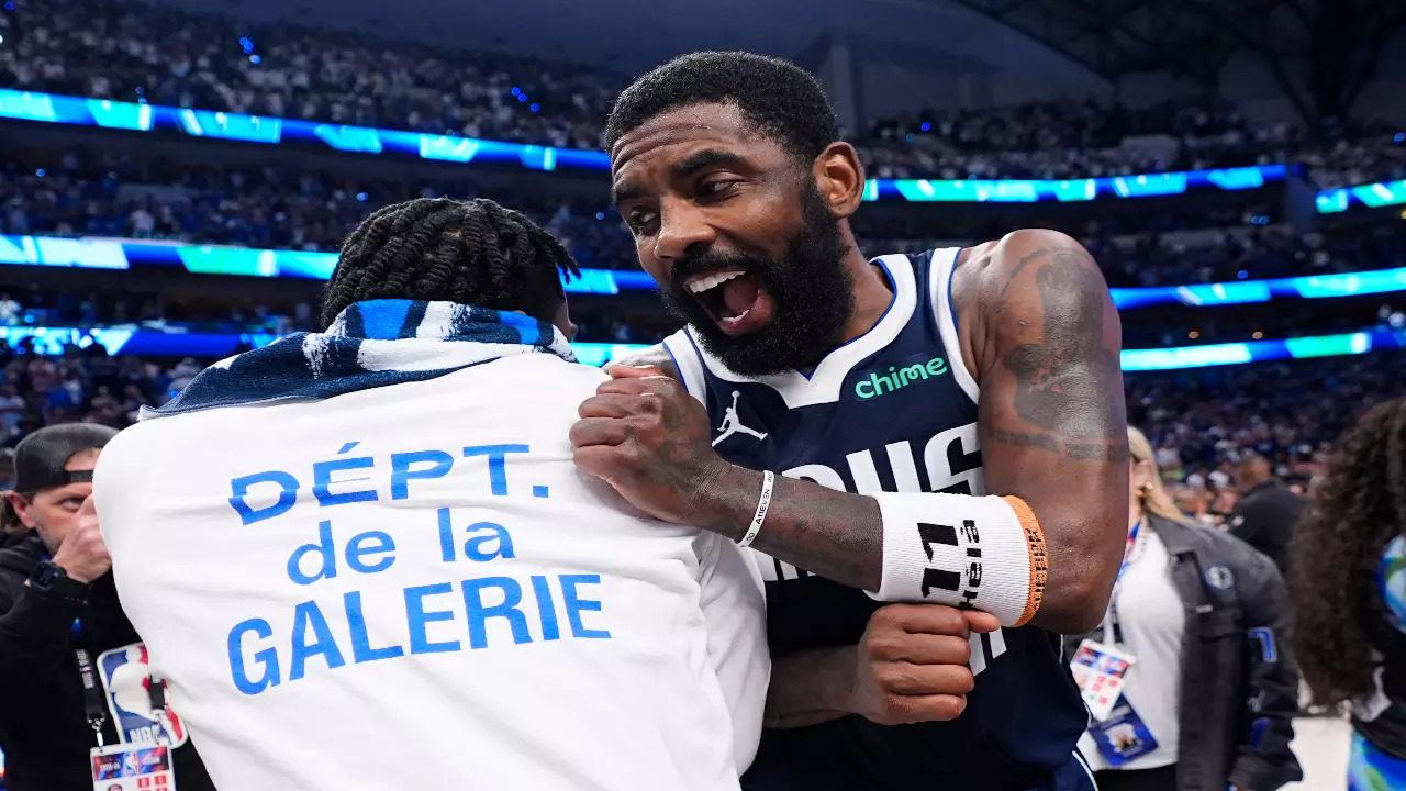 Dallas Mavericks' Kyrie Irving celebrates his team's win