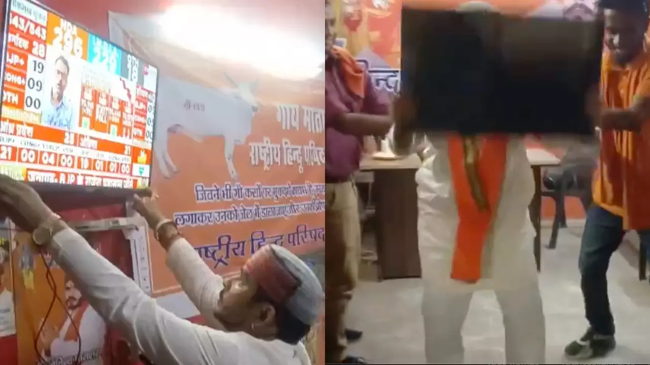 Rashtriya Hindu Parishad president Govind Parashar breaks his Agra office TV. | @Benarasiyaa/X