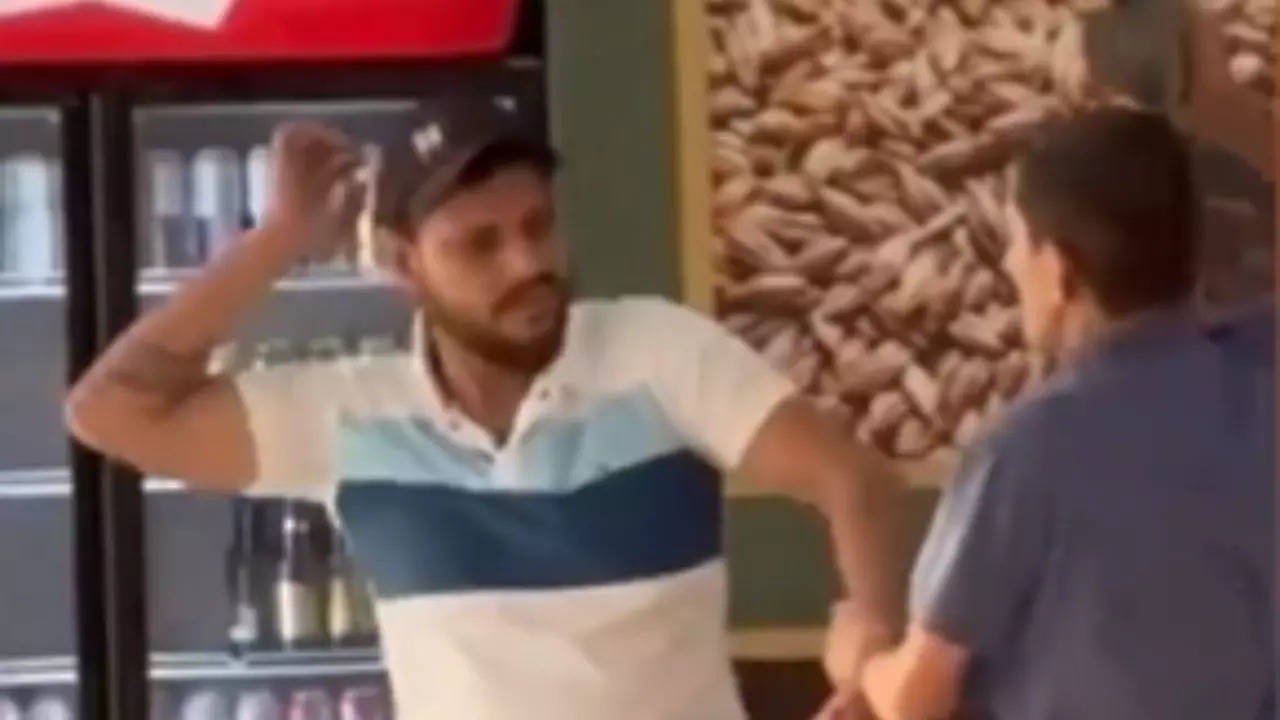 Viral Video: Indian Dad Beats Son with Slippers at Liquor Shop, Netizens Amused