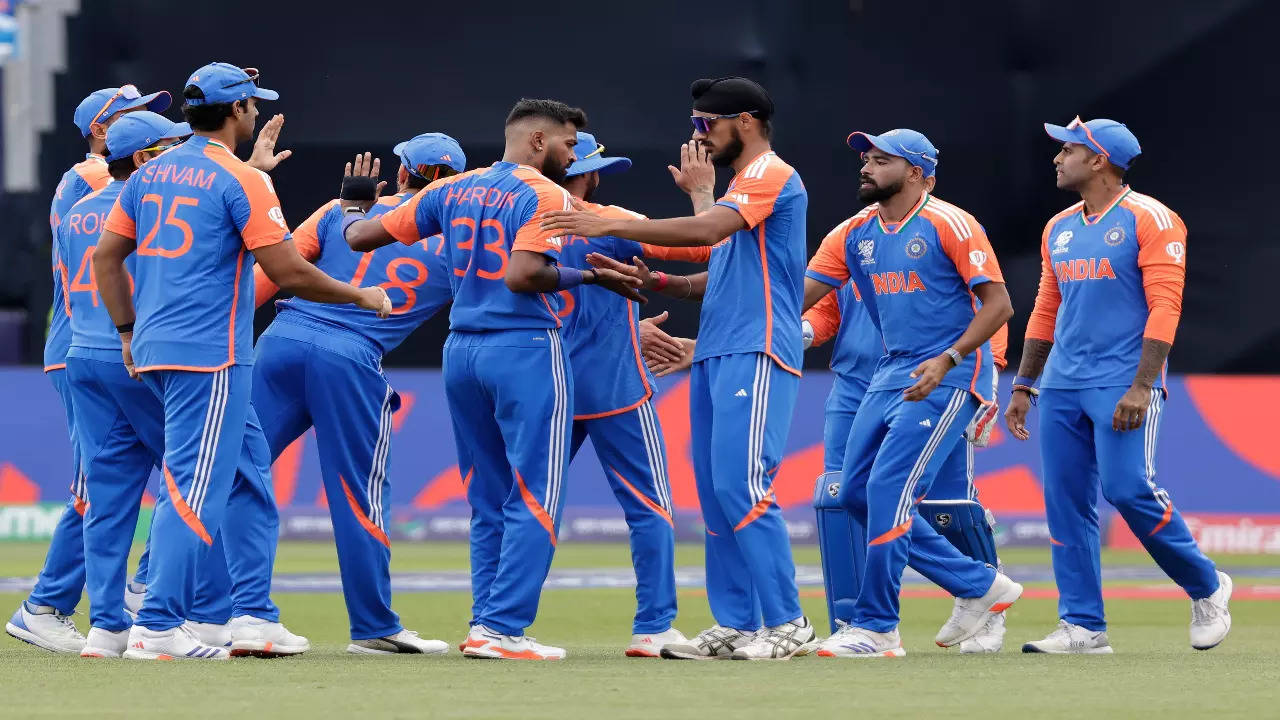 Indian players celebrate a wicket