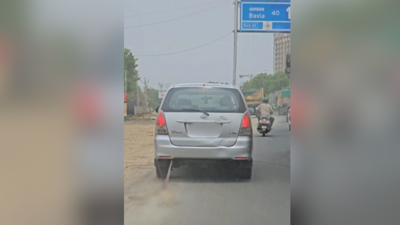 Car drags dead dog on Ahmedabad road