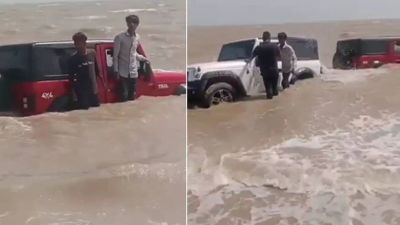 mahindra thar stunt gone wrong: gujarat youths in trouble after vehicles get stuck near seashore