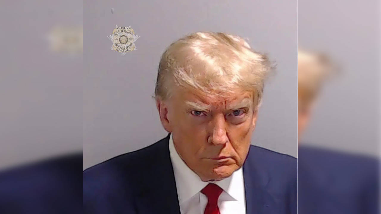 Trump in rage, in his iconic mugshot.