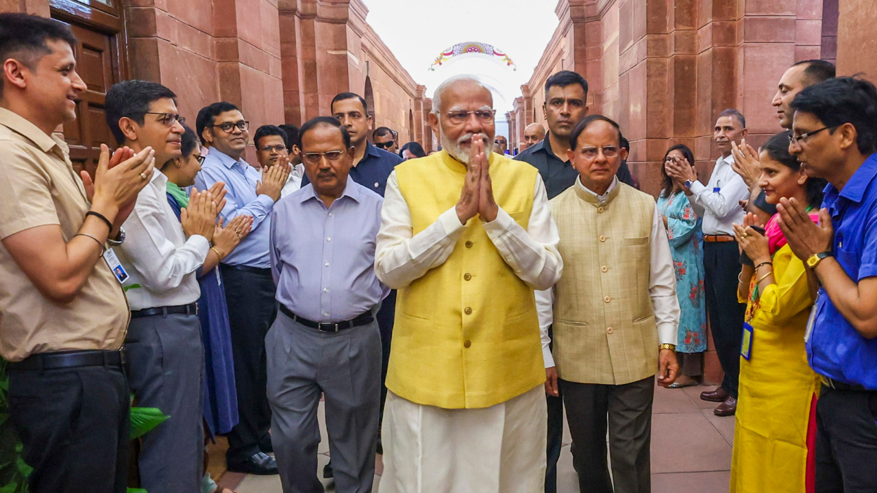 Prime Minister Narendra Modi being welcomed by the officials after taking oath for third-time in a row.