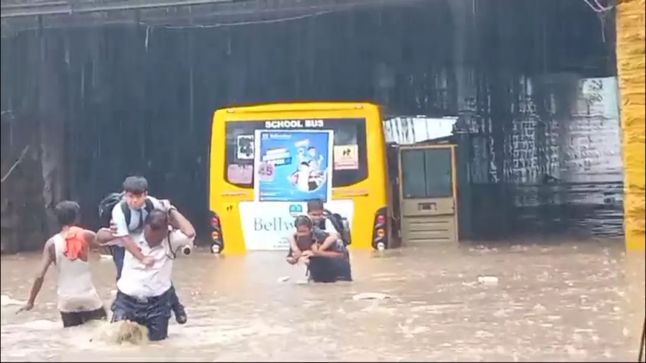 Schoolchildren being rescued from flooded bus