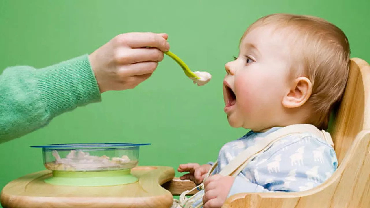 What Is The Best Age To Stop Hand-Feeding Your Child? Expert Answers