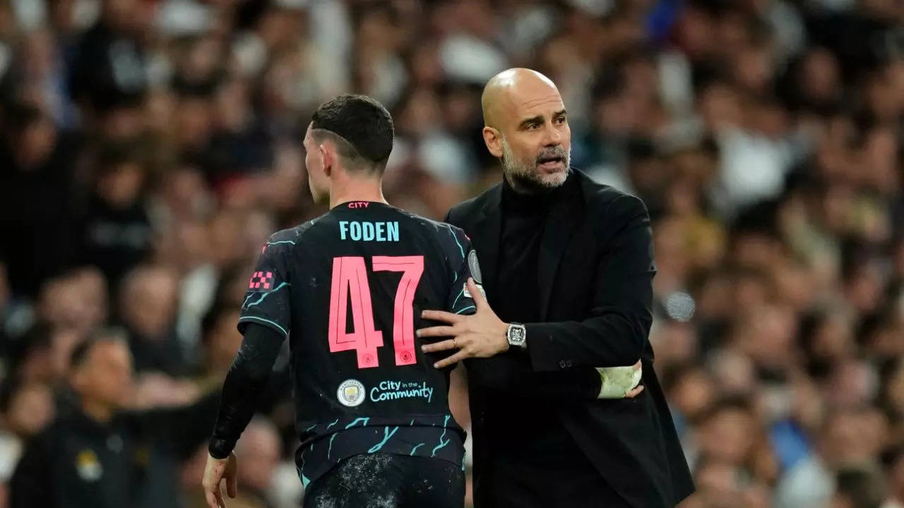 Phil Foden and Pep Guardiola