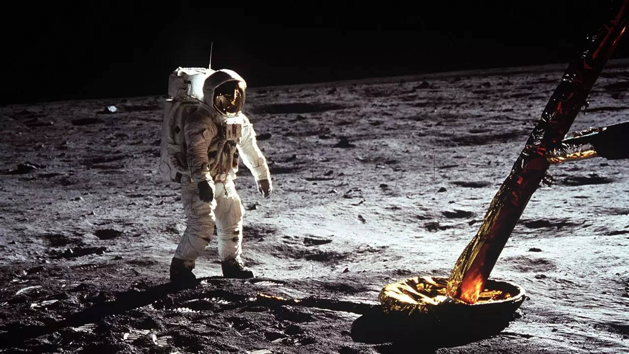 Astronaut Buzz Aldrin walks on the surface of the Moon near a leg of the lunar module during Apollo 11. Credits: NASA