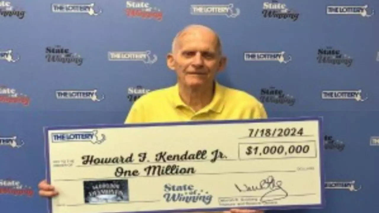 Howard Kendall Jr with his $1 million cheque. | Massachusetts State Lottery