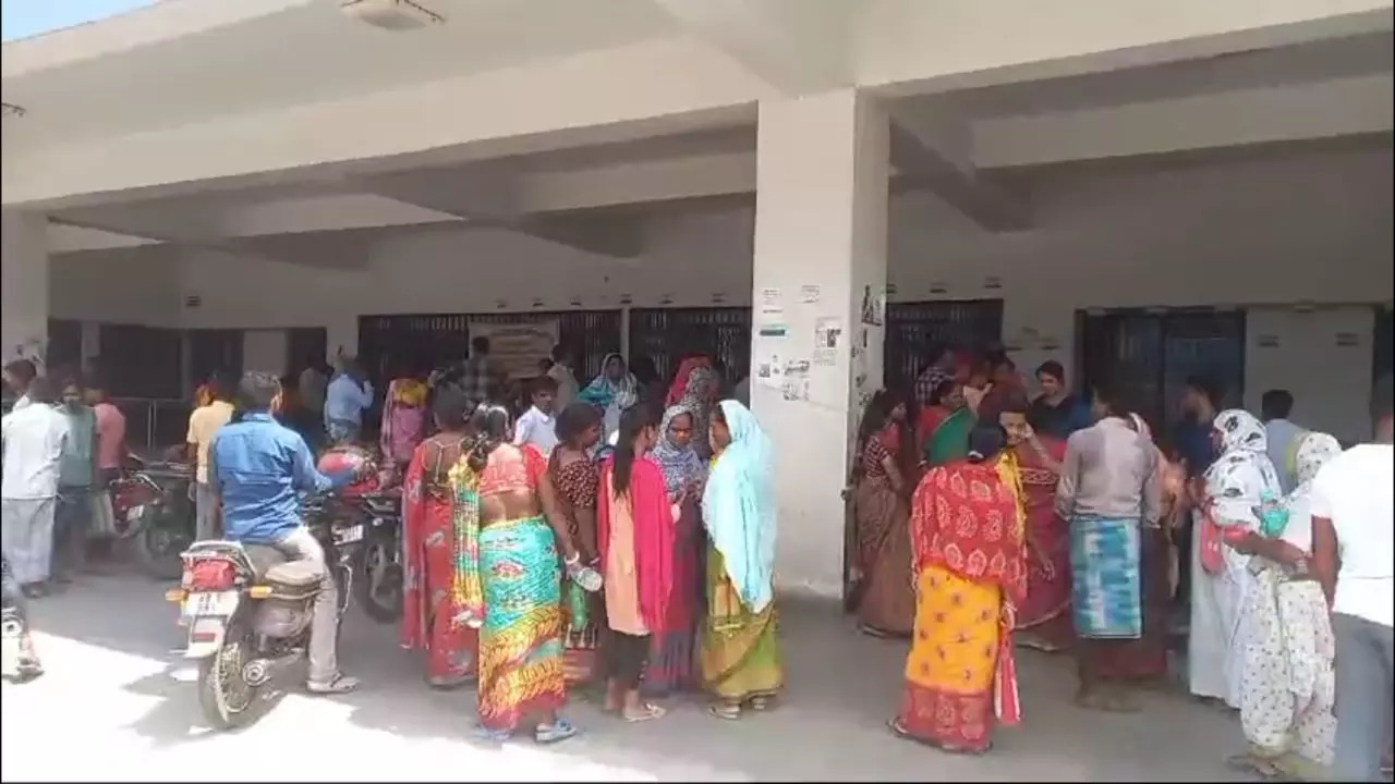 Crowd gathers outside the hospital where the victims were admitted for surgery