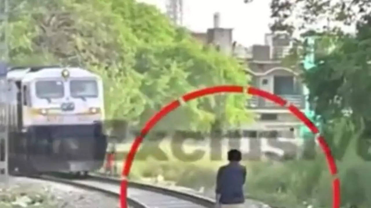 Man Jumps on Railway Track to Stop a Moving Train