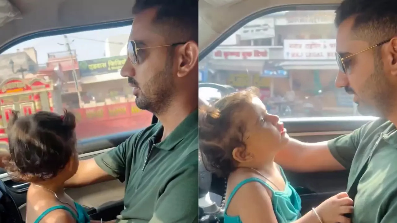 A man drives a Swift DZire with his daughter in his lap in Rajasthan. | Pratima Chauhan/X